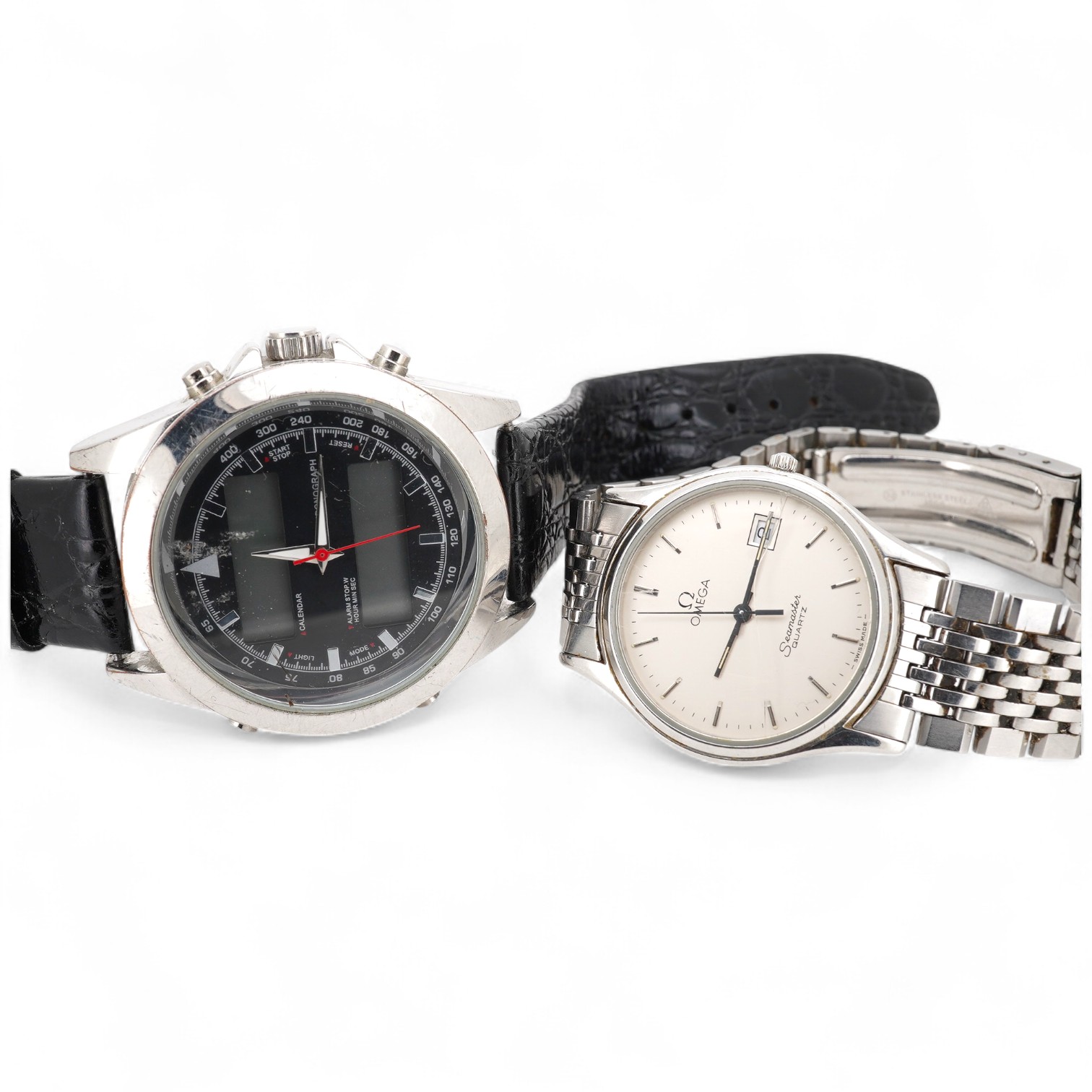 A gentleman's 1980's stainless steel Omega Seamaster quartz wrist watch, with baton numerals and date aperture, case diameter 33mm, (glass cracked), on a stainless steel Omega bracelet, no box or papers, together with on